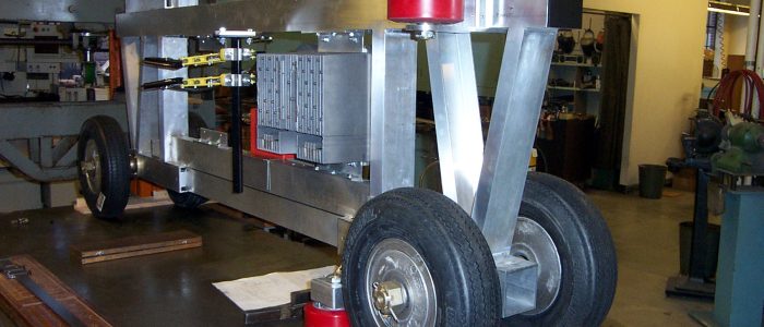 Small vehicle chassis supports and moves passenger cabin.