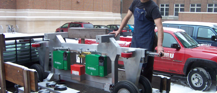 Small vehicle chassis supports and moves passenger cabin.